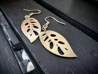 Laser cut brass Monstera adansonii dangle earrings with brushed finish from Finger Lakes Laser